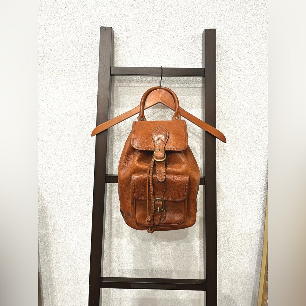 Brown leather backpack.